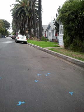 blue wave painted on street pavement