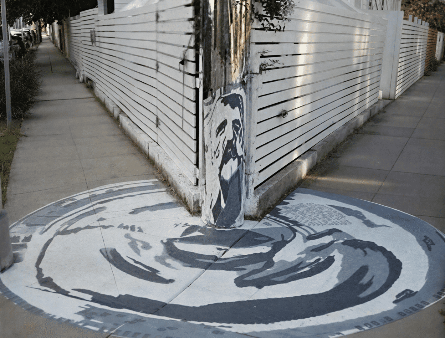 Artistic mural on urban sidewalk corner