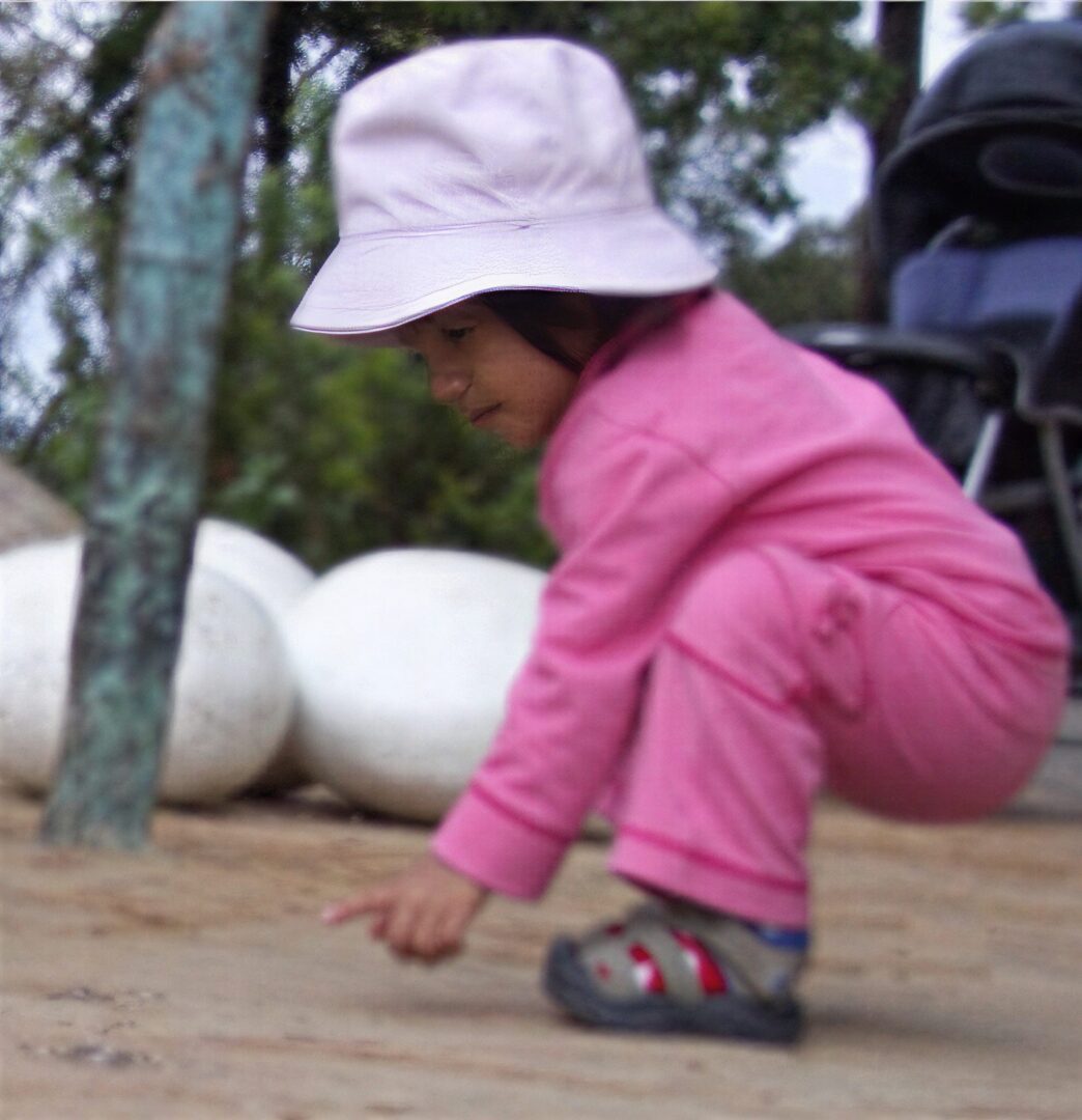 Toddler in pink outfit outdoors