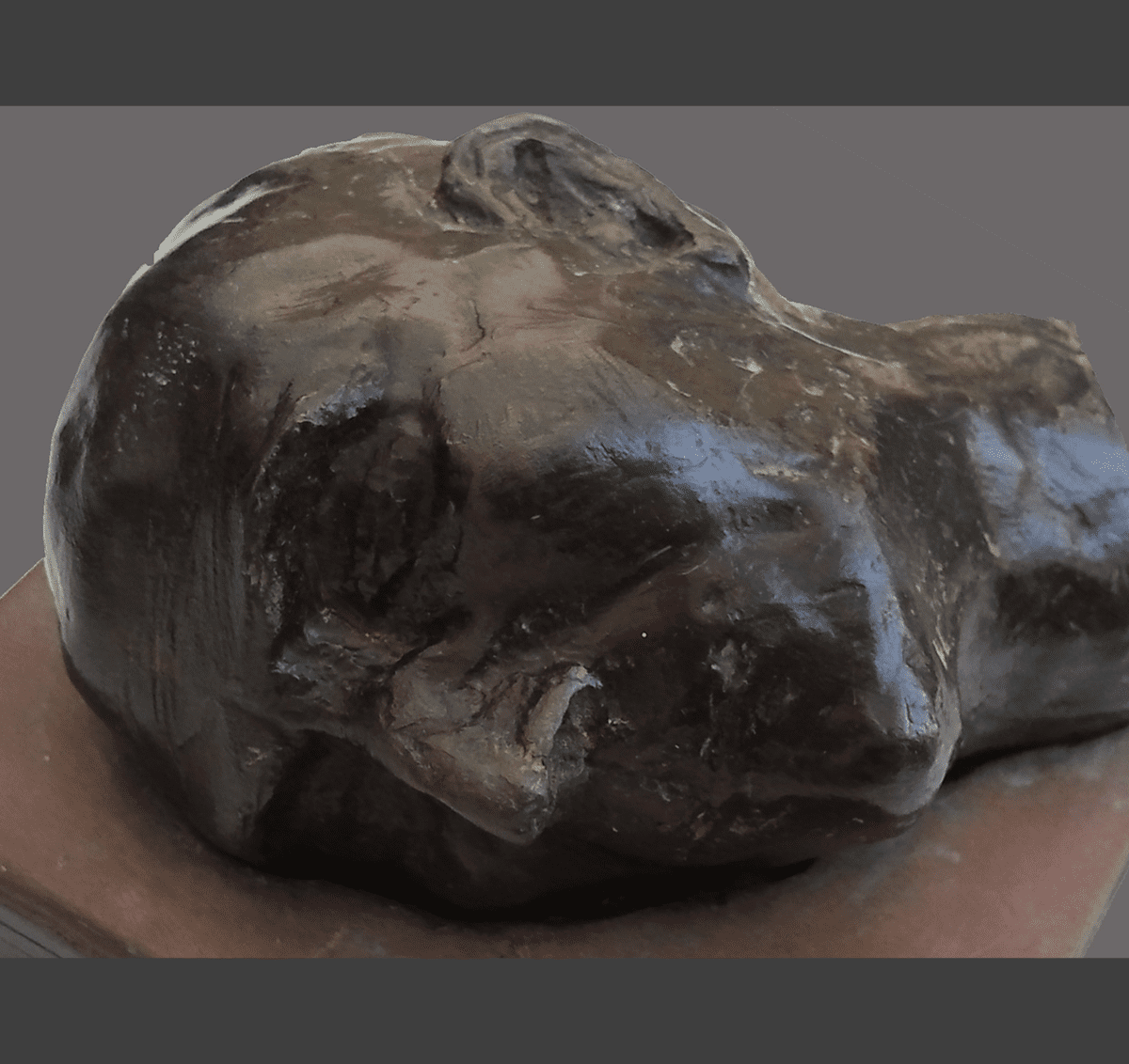 Bronze feline sculpture on plinth