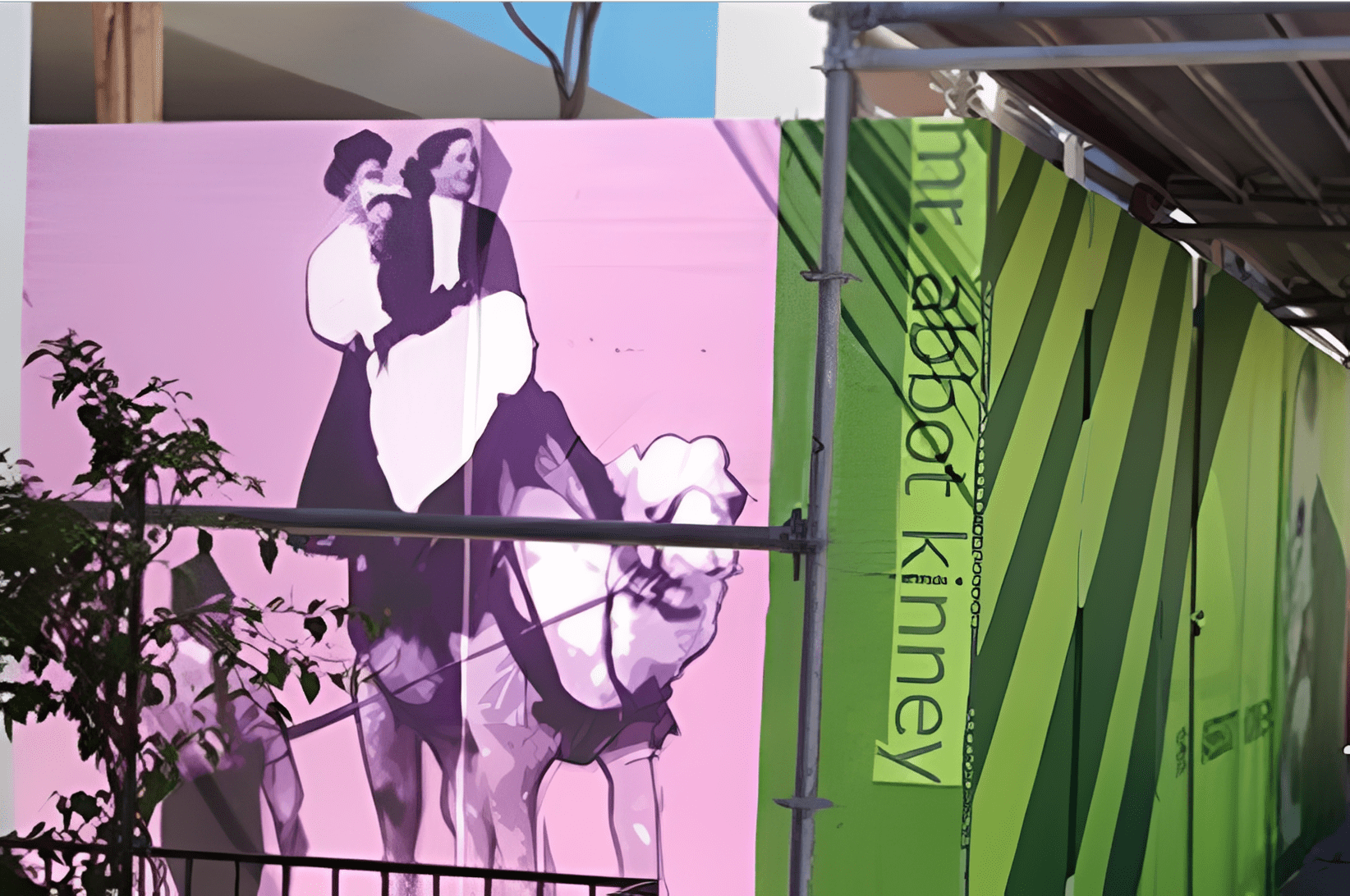 Urban artwork with green and purple tones
