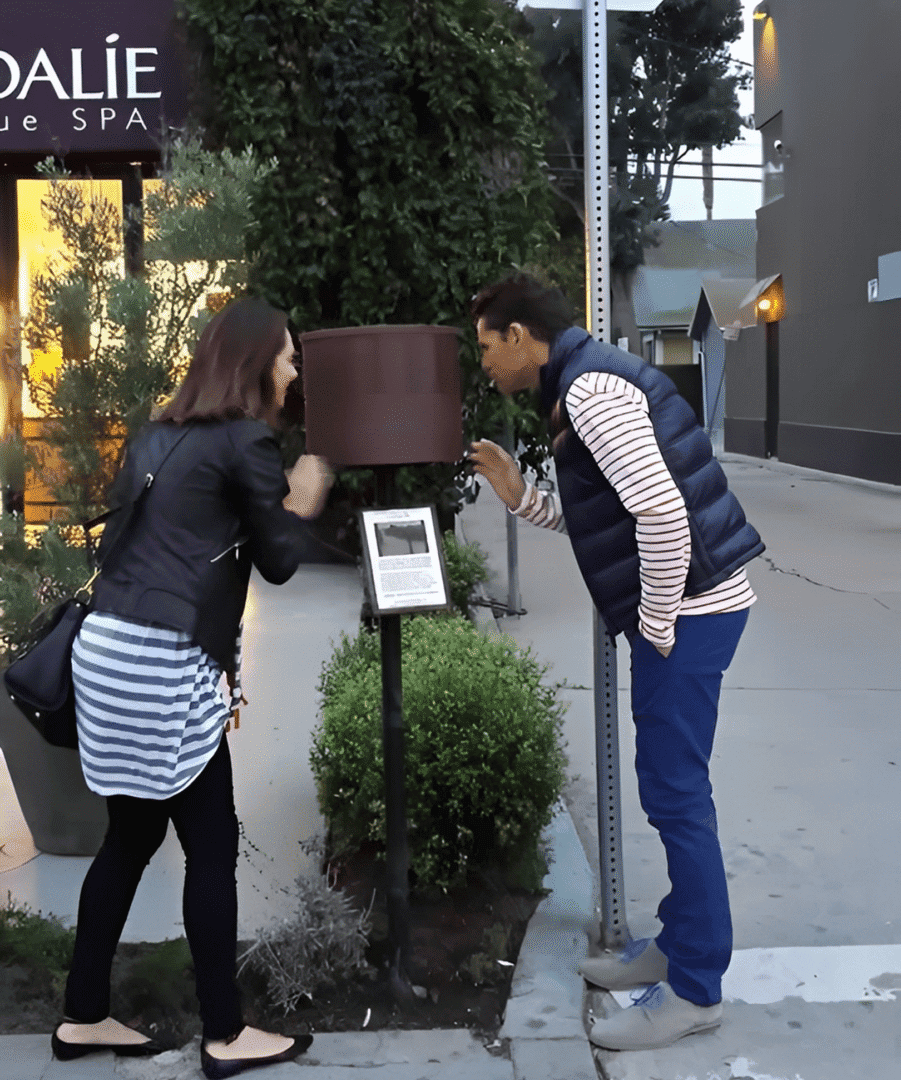 People interacting with outdoor installation