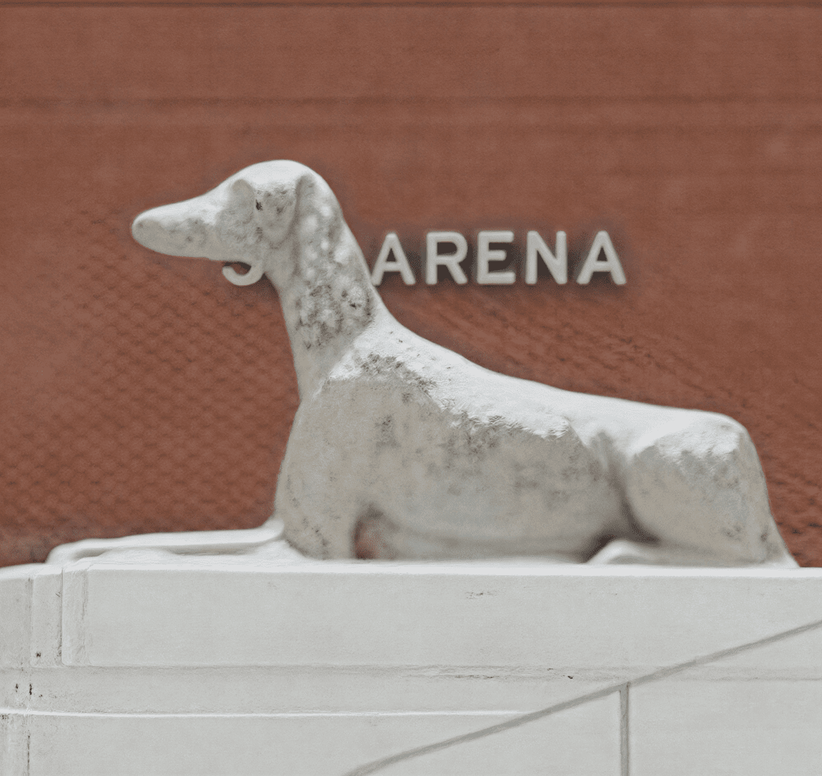 Canine sculpture on architectural structure