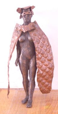 Bronze statue with a quilted cape.