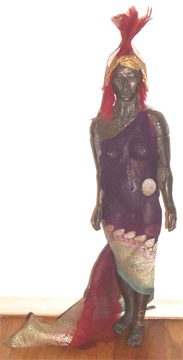 Statue of a figure in decorative attire.