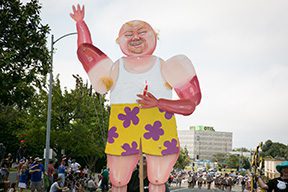 Cartoonish float of a waving man.
