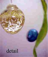 Glass ornament with blue and green details.