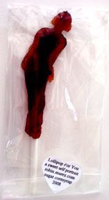 Red lollipop shaped like a person.