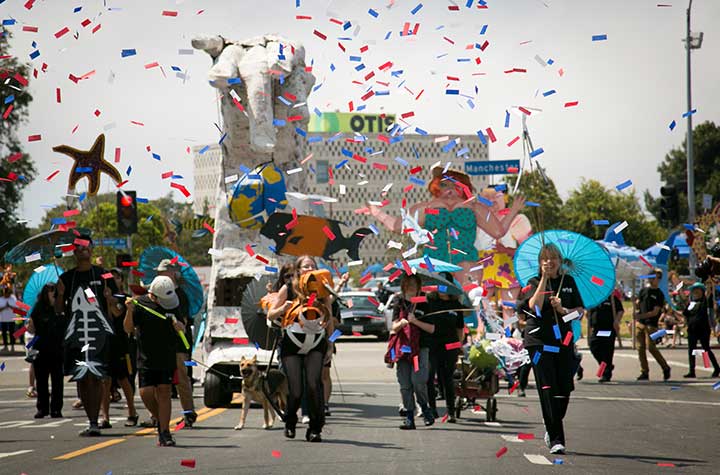 Parade with colorful confetti and costumes.
