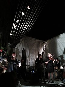 Live band performing at night event.