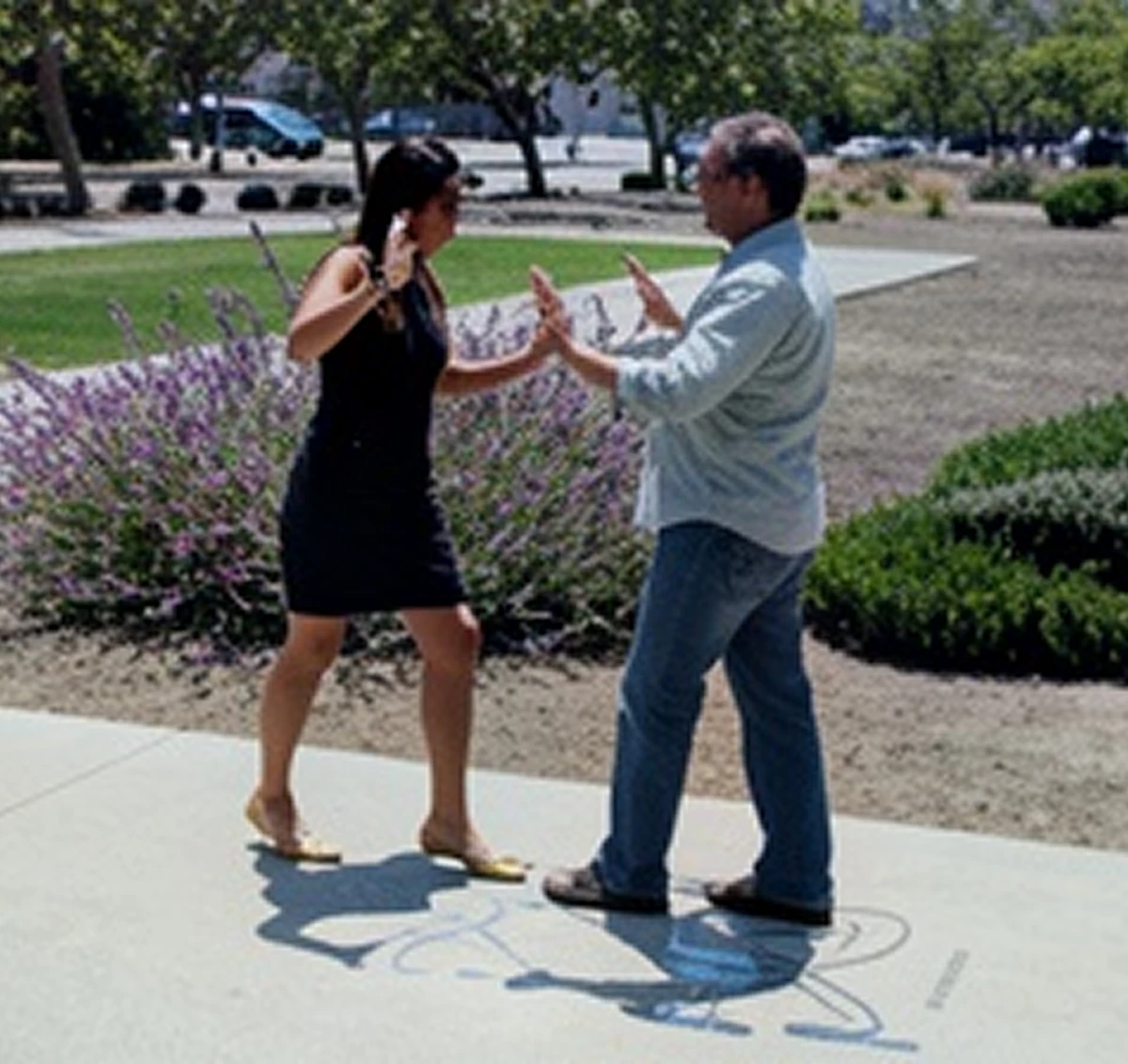 Two people engaged in outdoor conversation.