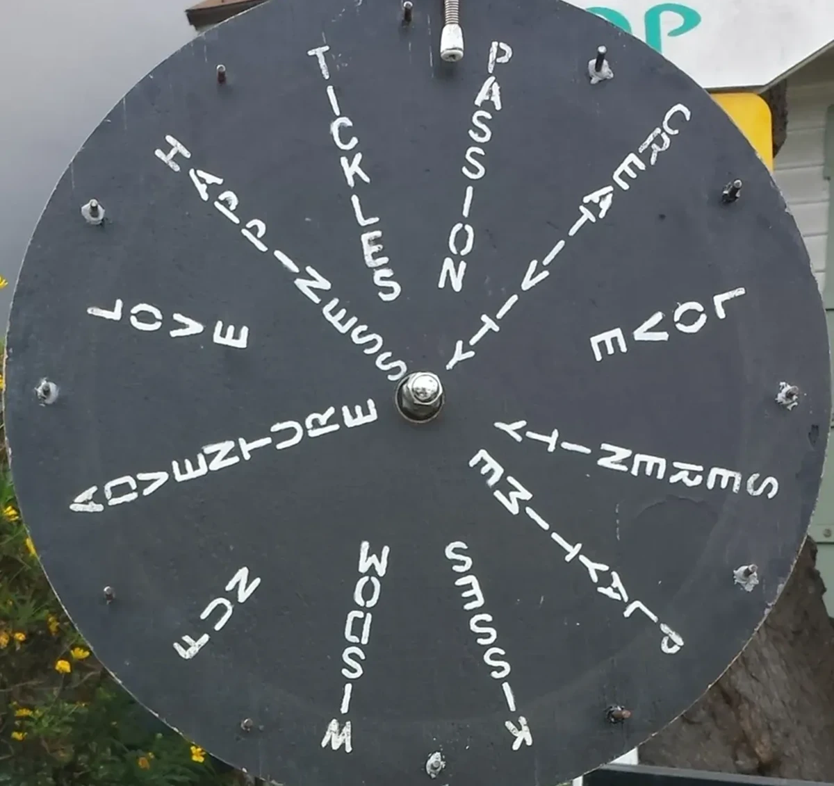 Black wheel with words in white text.