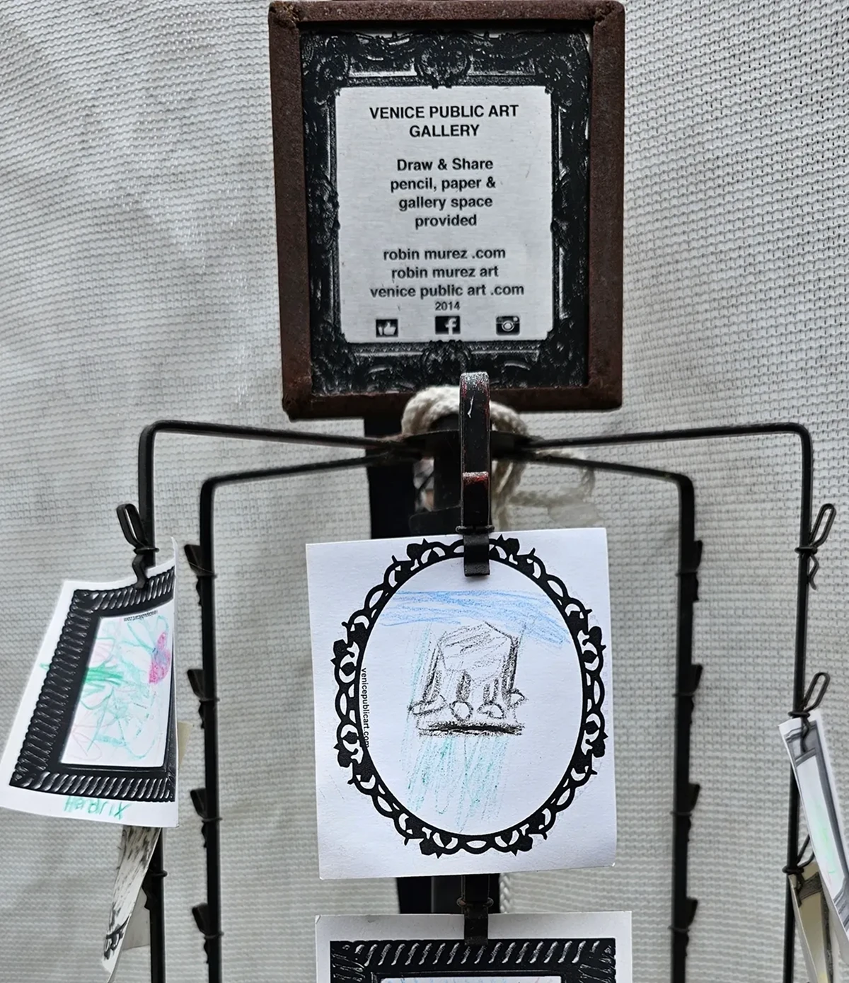 Art display with drawing and information sign.