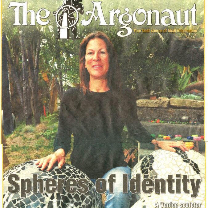 Artist with sculpted mosaic on magazine cover