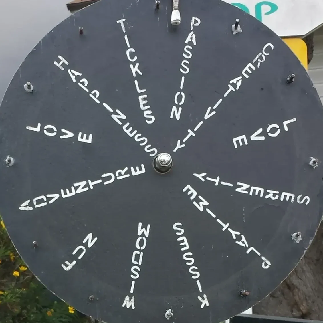Black wheel with words in white text.