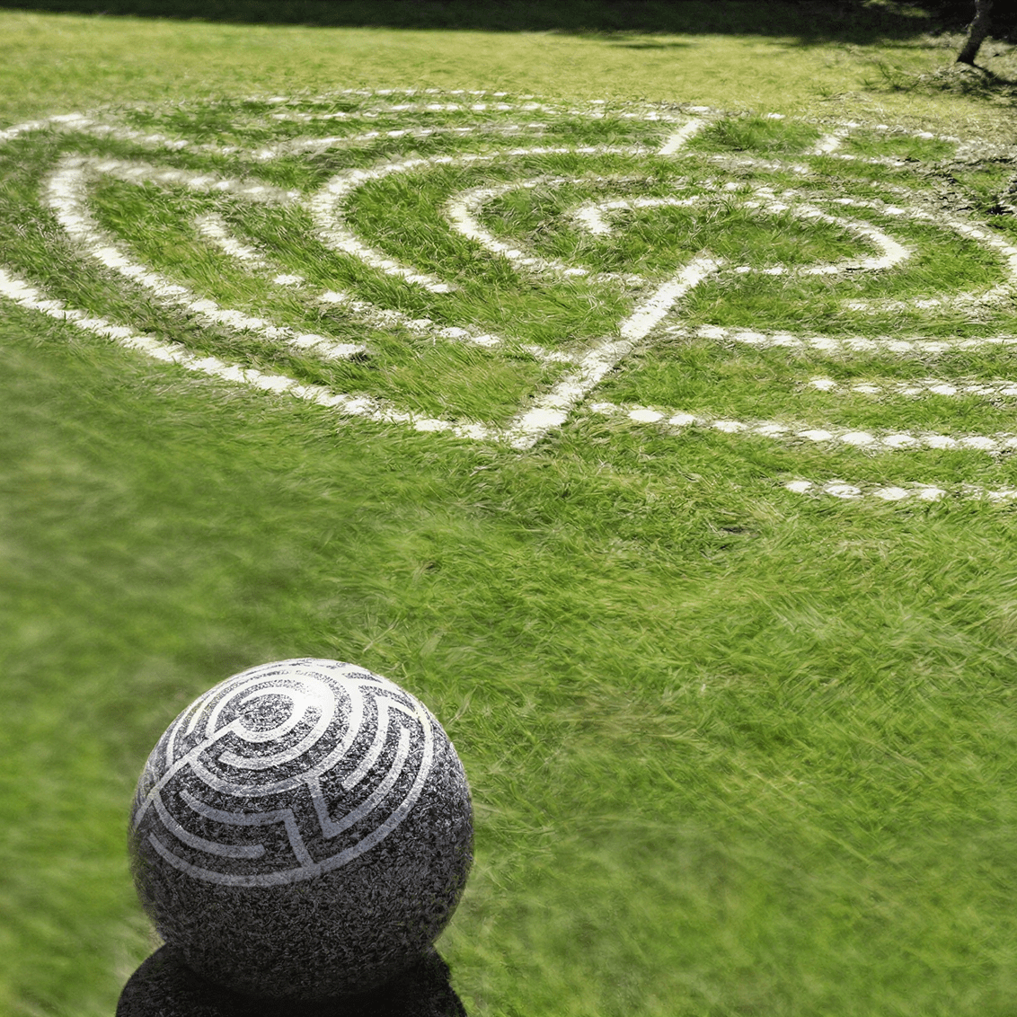 Grass maze with decorative stone ball