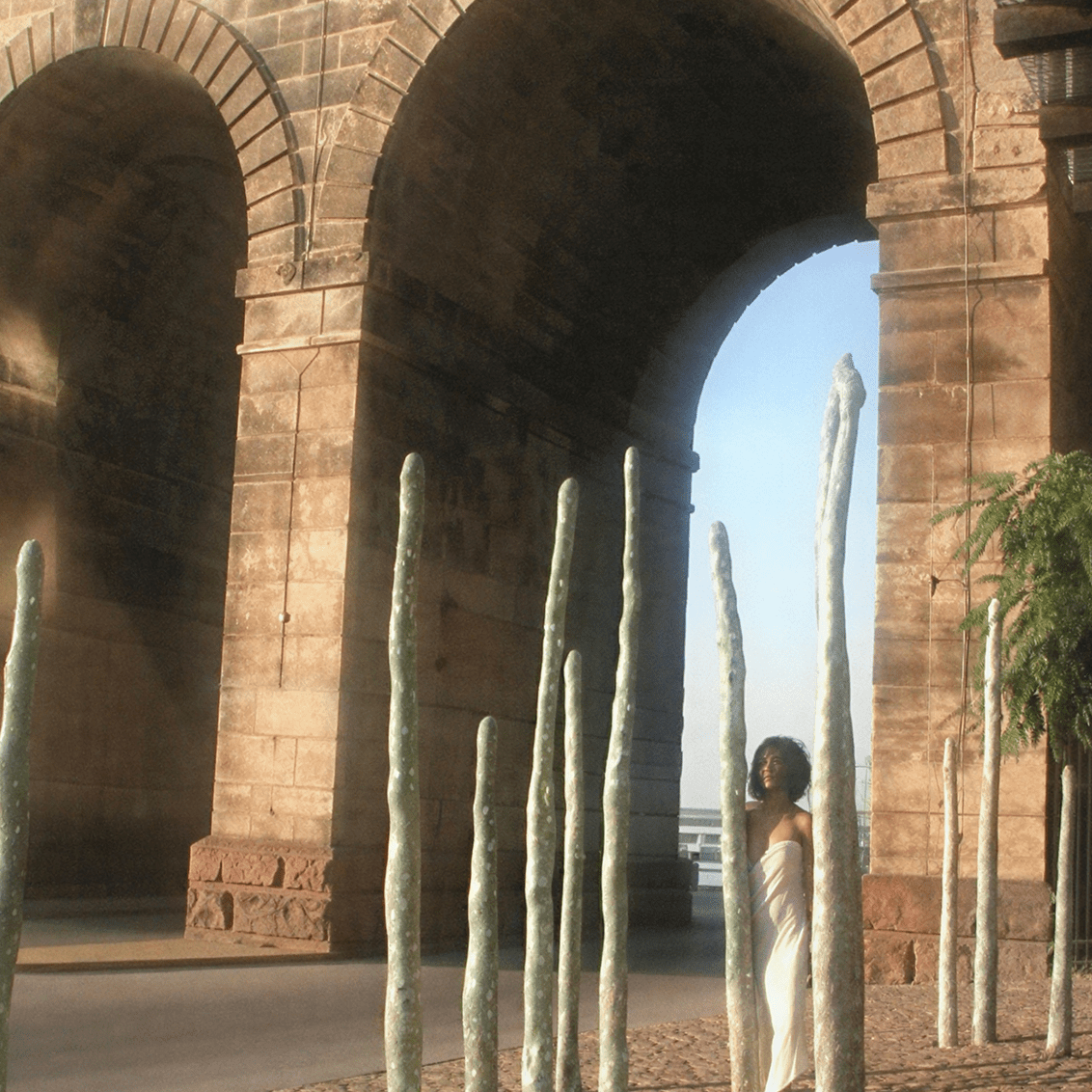 Stone arches with tall sculptures