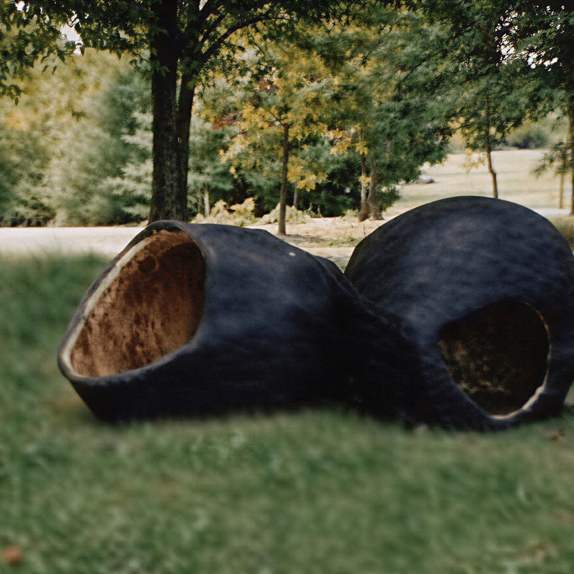 Black stone structures in park setting