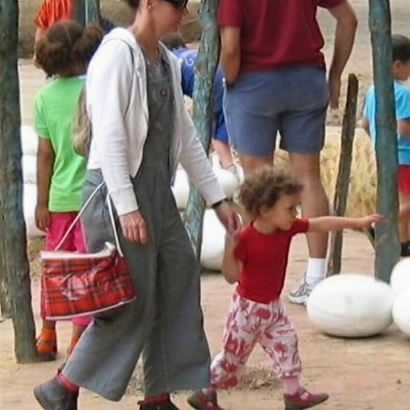 Woman and child walking outdoors